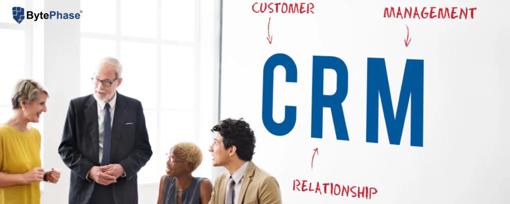Repair shop owner reviewing customer relationship management (CRM) software on a laptop